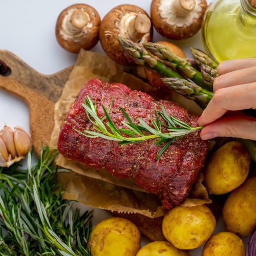 raw-meat-red-beef-with-green-rosemary-fresh-vegetables-wooden-cutting-board raw-meat-red-beef-with-green-rosemary-fresh-vegetables-wooden-cutting-board