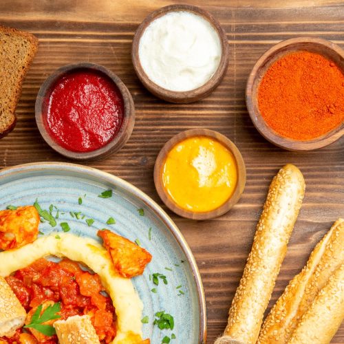 top view delicious chicken slices with mushed potatoes and seasonings on a wooden desk potato meal food spicy pepper